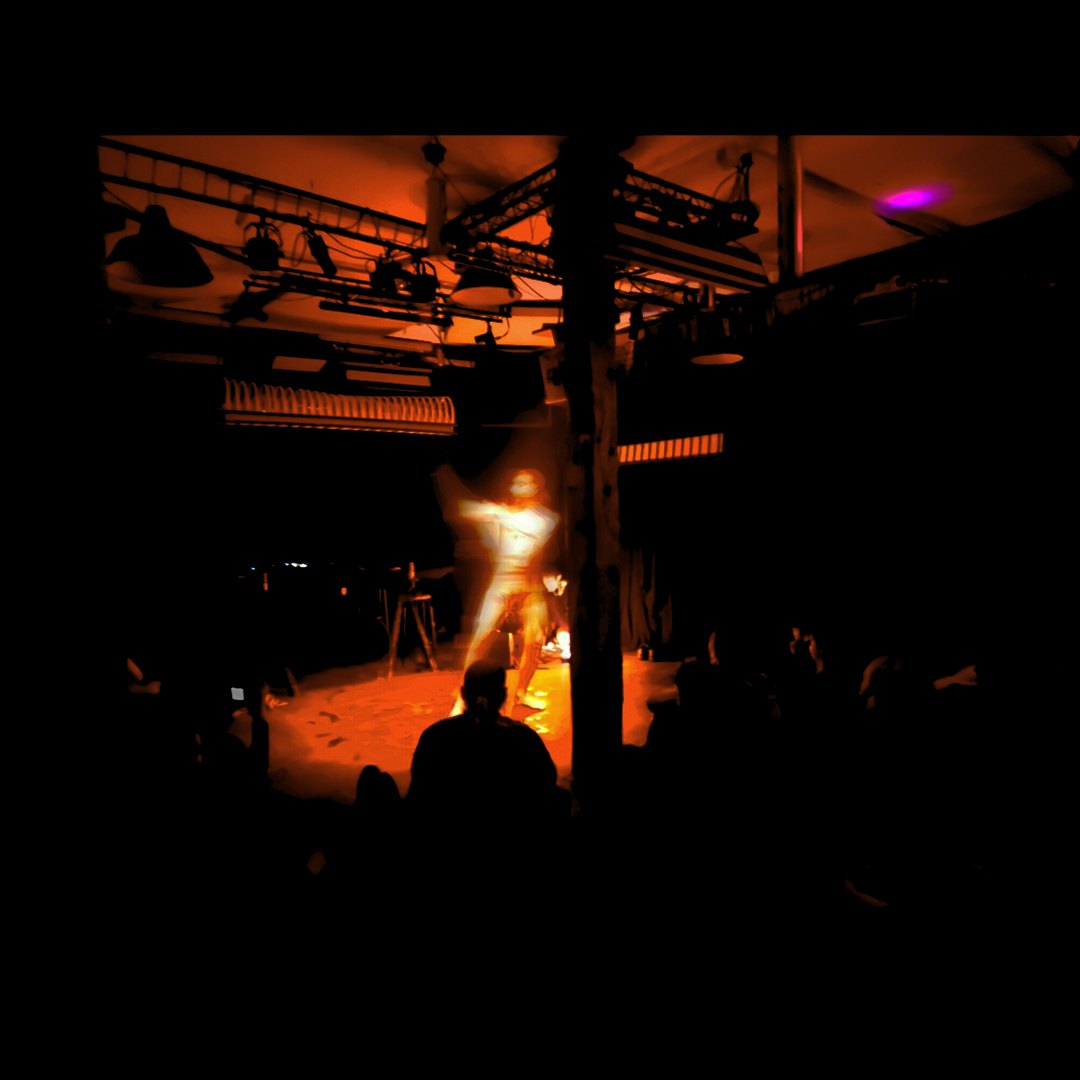 Akad⁰ performing Momentum under warm stage lighting at Kultur Lounge, Leipzig · 15